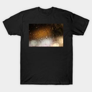 Deatil of raindrops on a car windshield at night T-Shirt